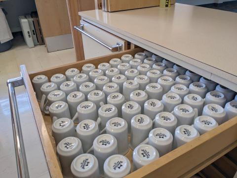 Drawer of mugs in Fellowship Hall kitchen