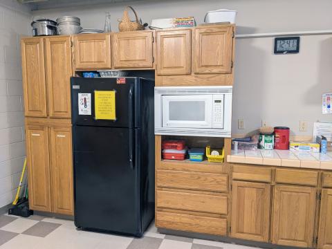 Refrigerator and microwave in Mayflower Room Kitchen